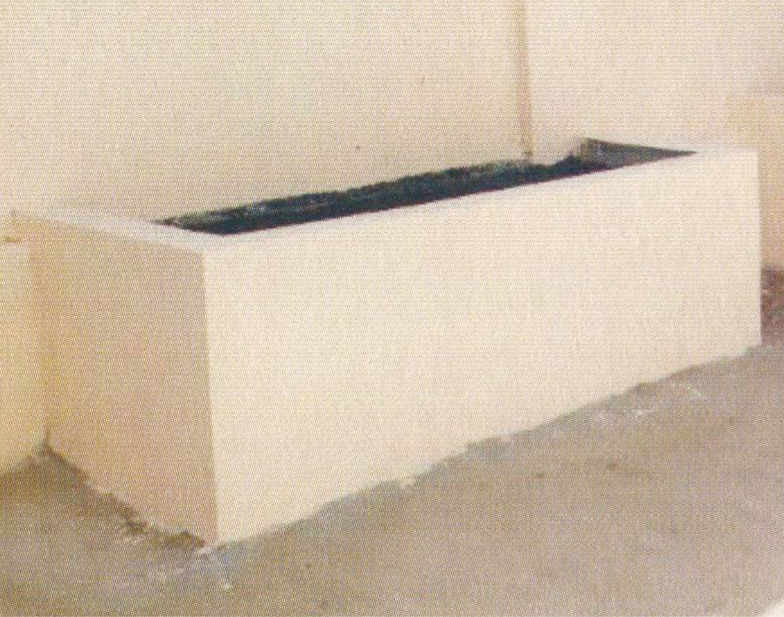 A rectangular planter with soil - type 2