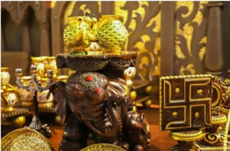 Decorative items including an elephant statue and swastika symbol